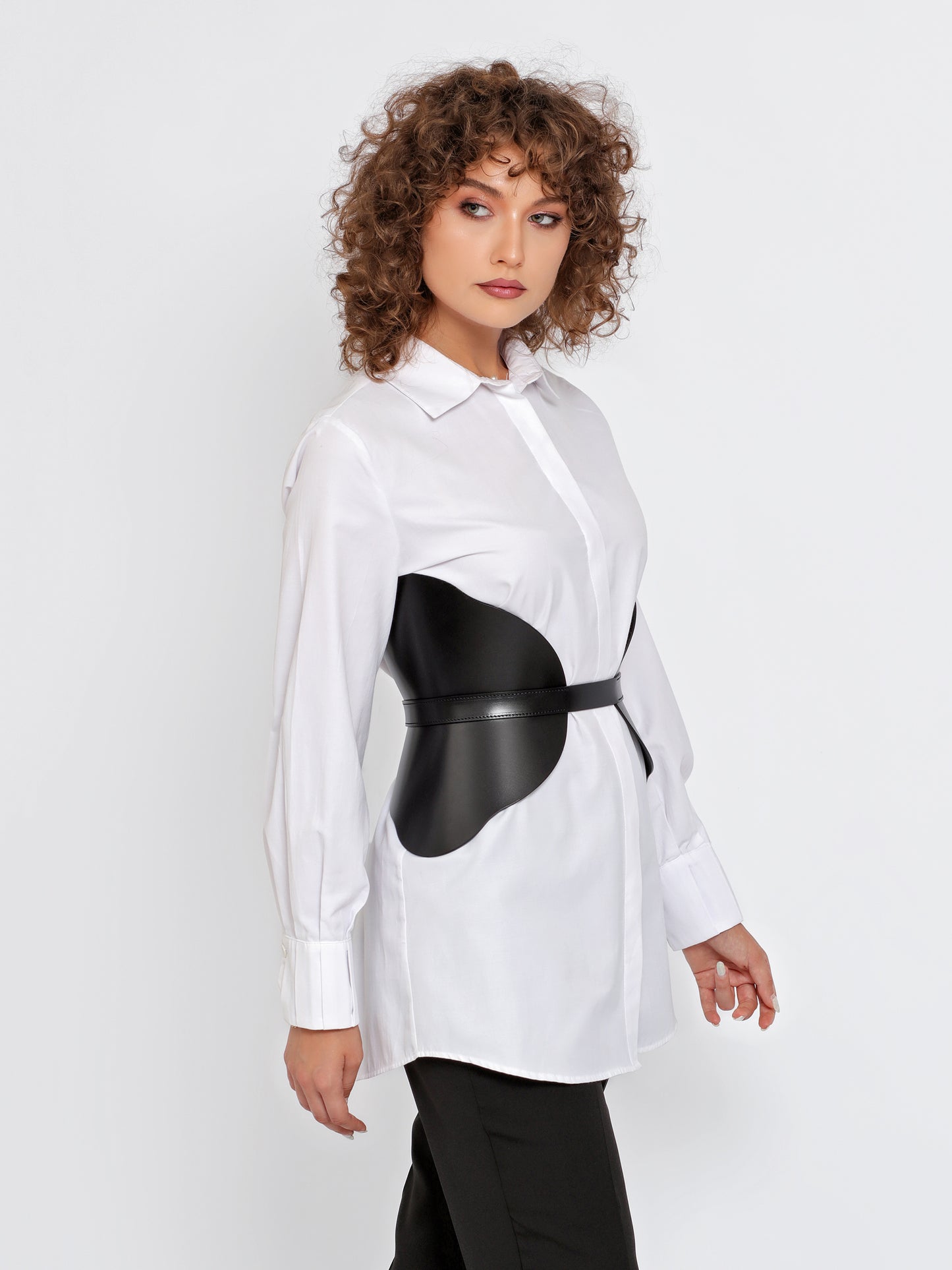 Side view of Leather Corset Belt worn by model over white shirt.