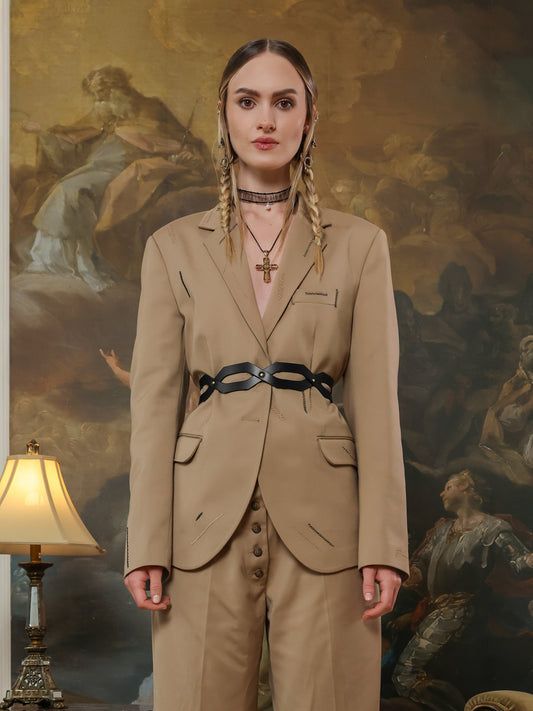 Fashion waist belt featuring linked cutout panels in black leather.