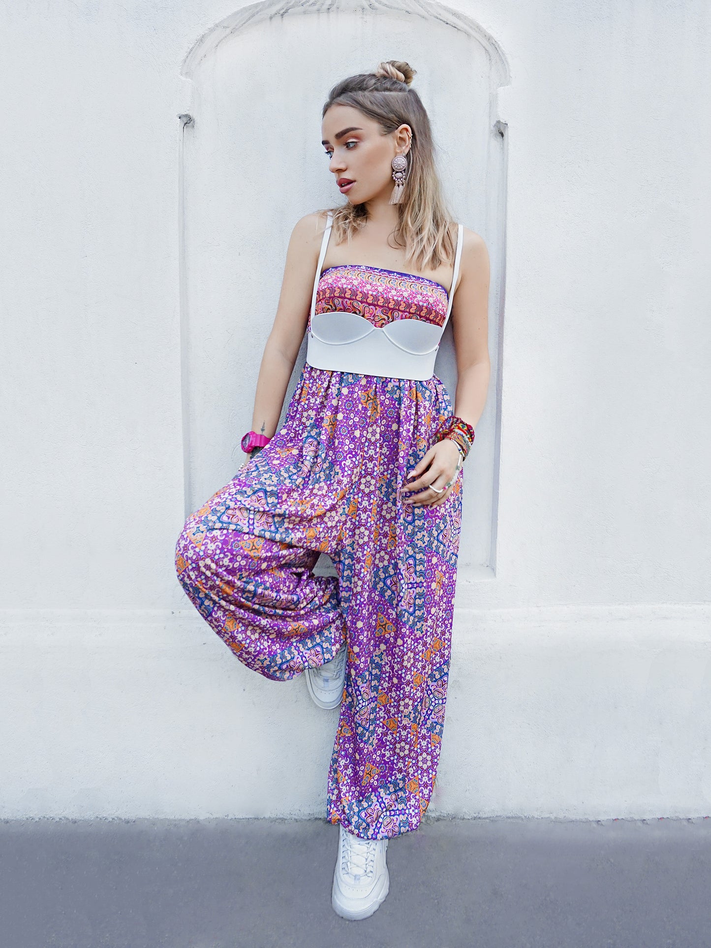 Underbust bra harness worn over colorful dress.