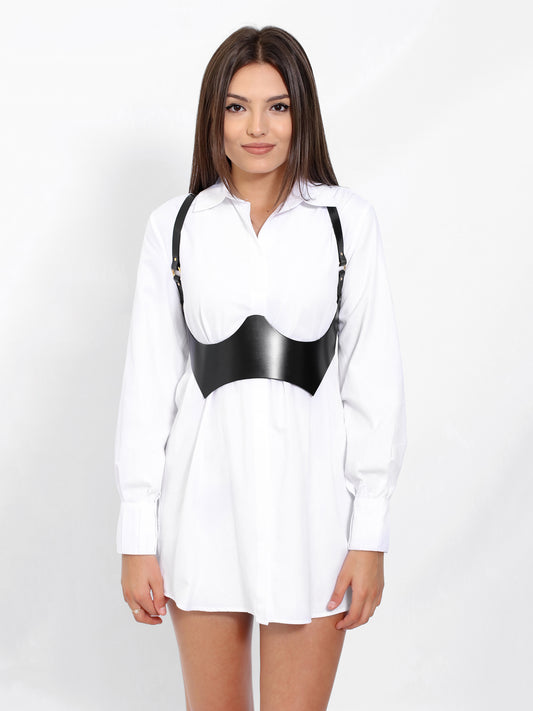 Leather under breast harness worn over shirt dress.