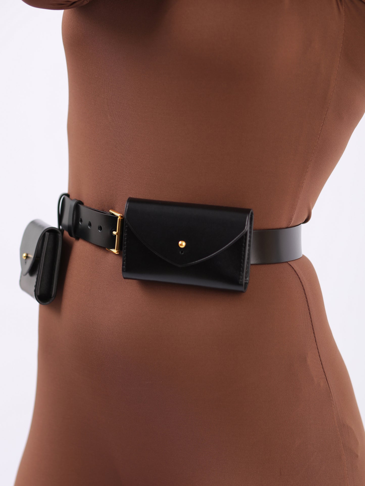 Detailed view of double micro belt bag.