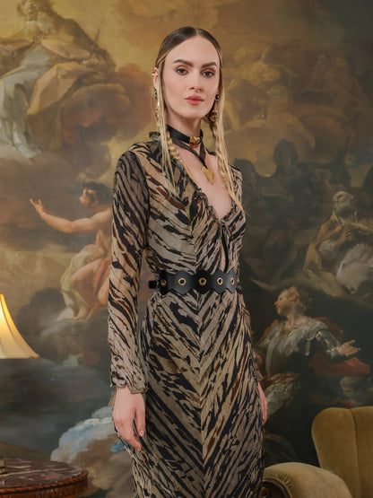 Black leather grommet belt worn with a deep-V neckline animal print dress.