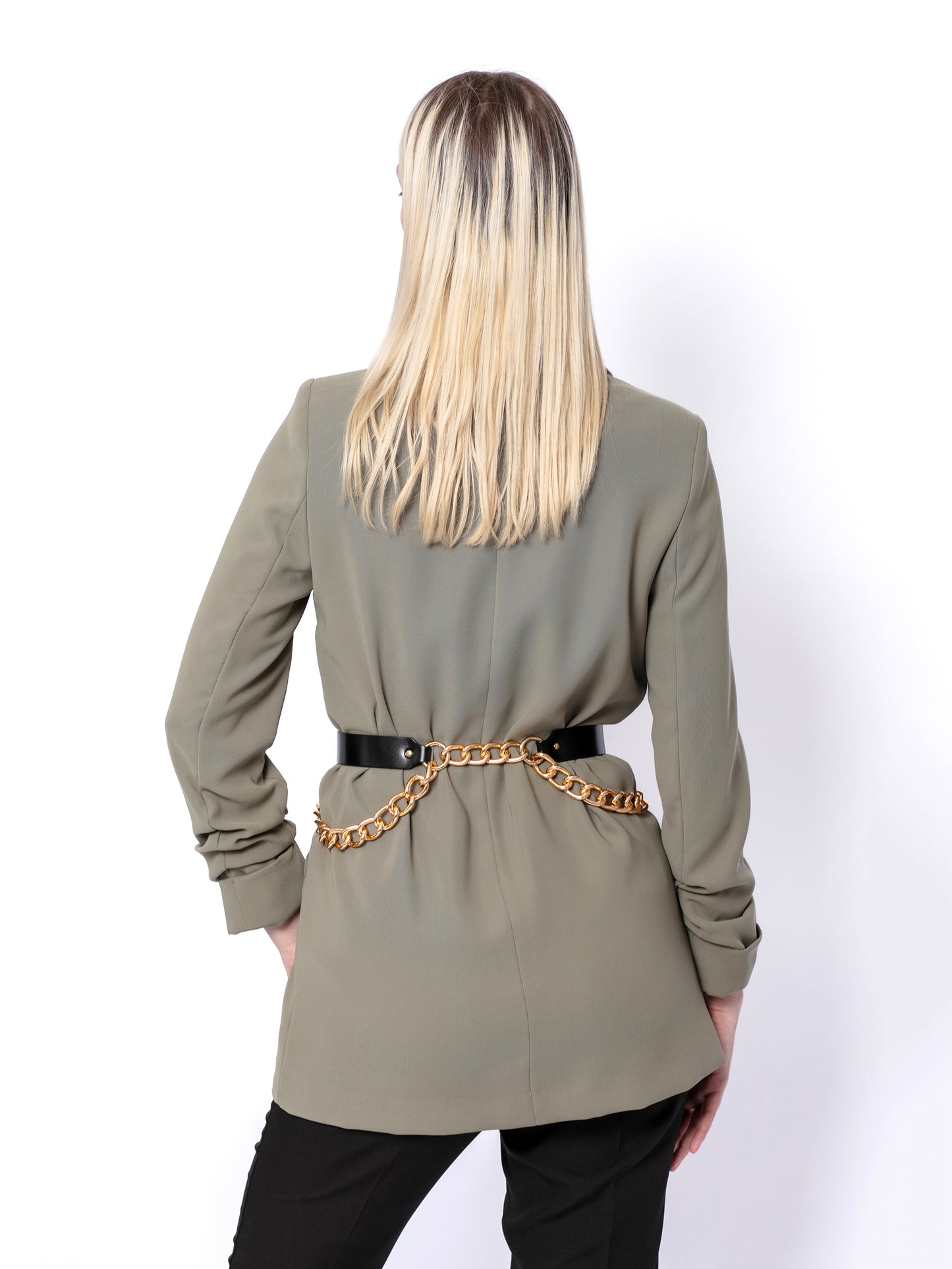 Back view of black double chain belt worn over green blazer.