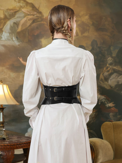 Back view of the black leather corset top with double buckle straps.