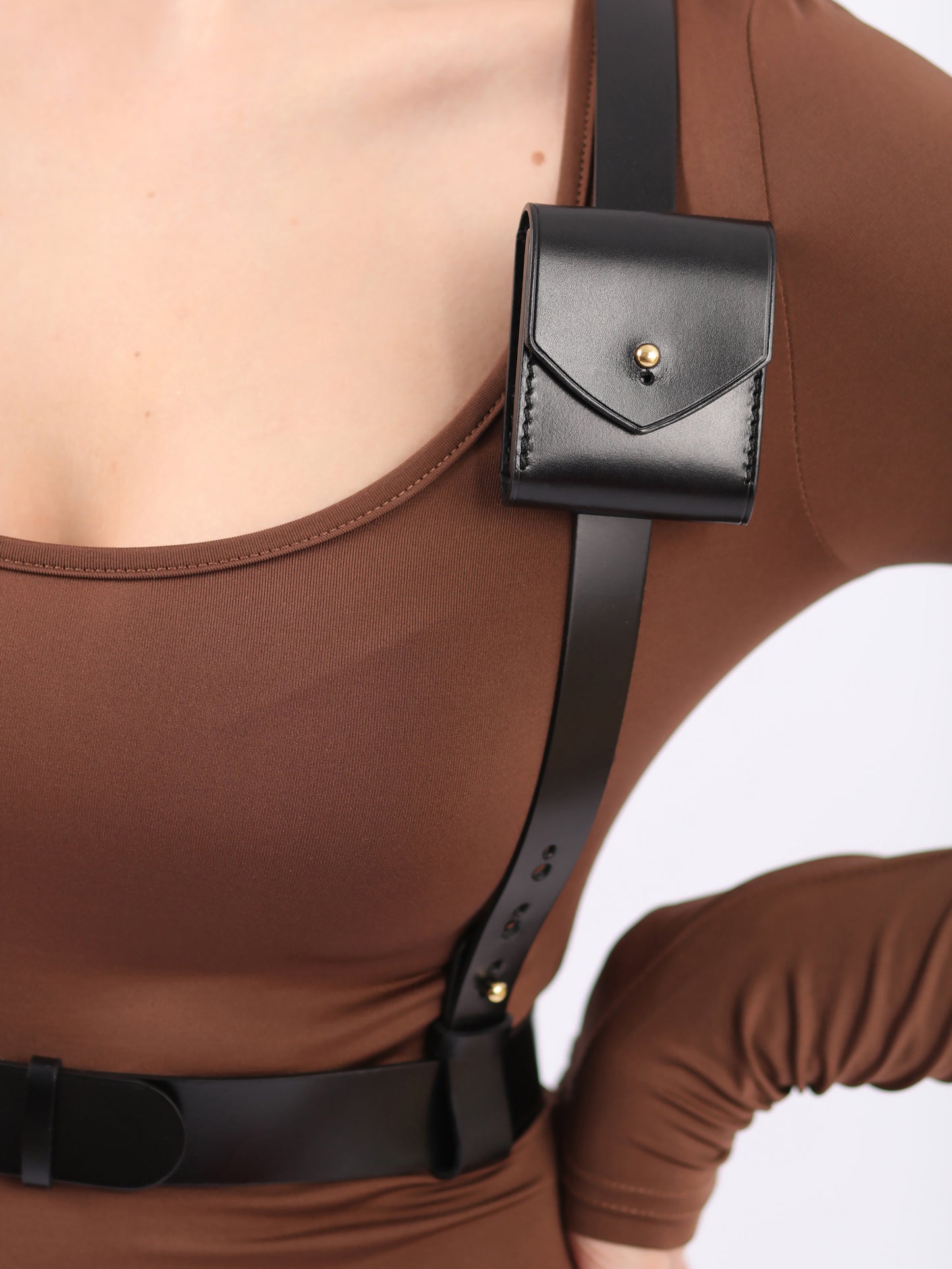 Detailed view of leather pocket harness.