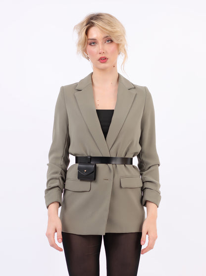 Black micro belt bag fitted on woman wearing green blazer.