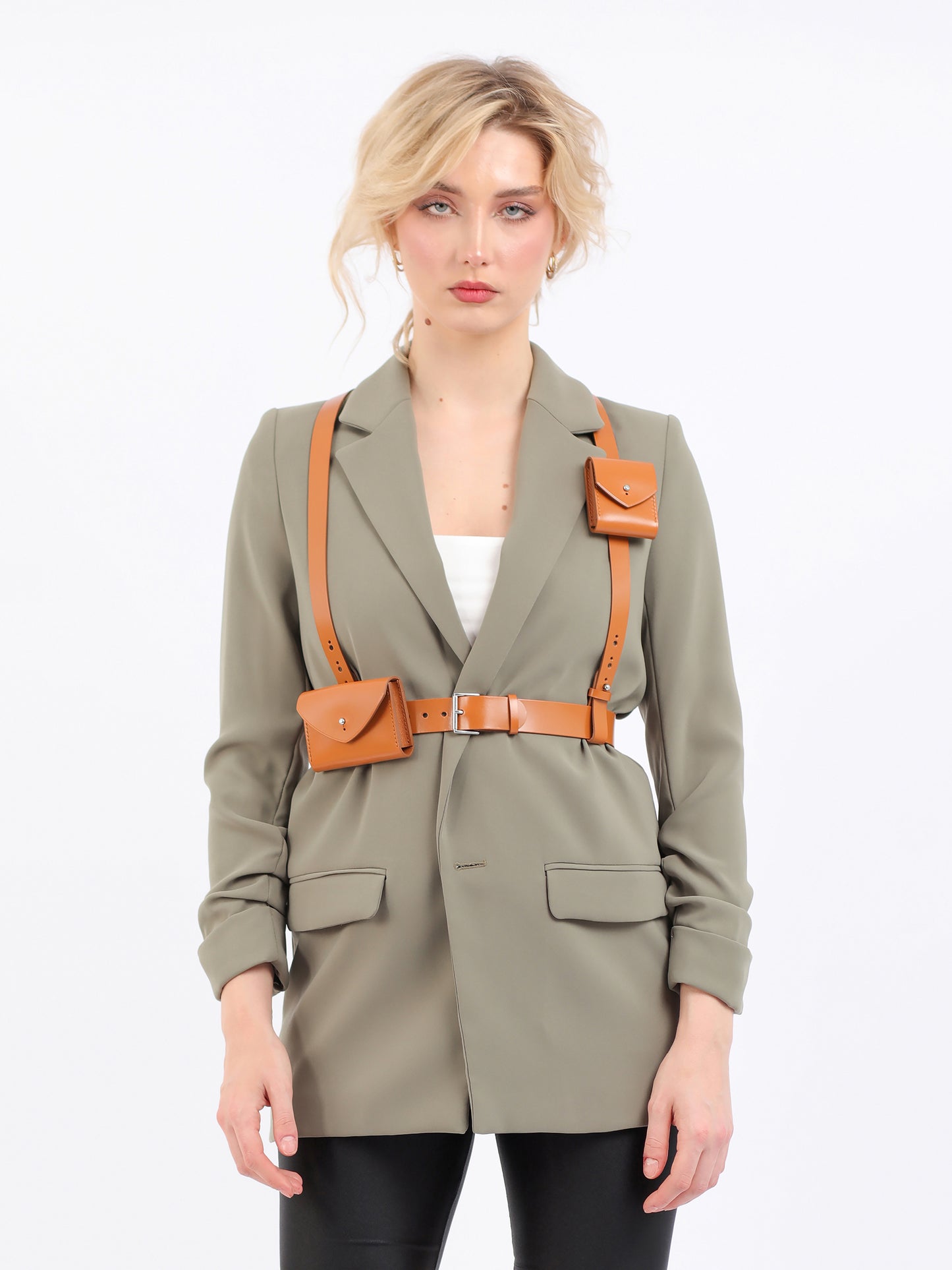Browun double bag harness fitted on model wearing green blazer.