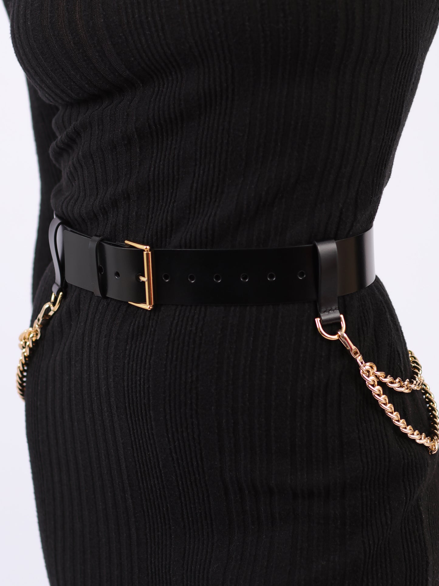 Detailed view of double chain leather belt.