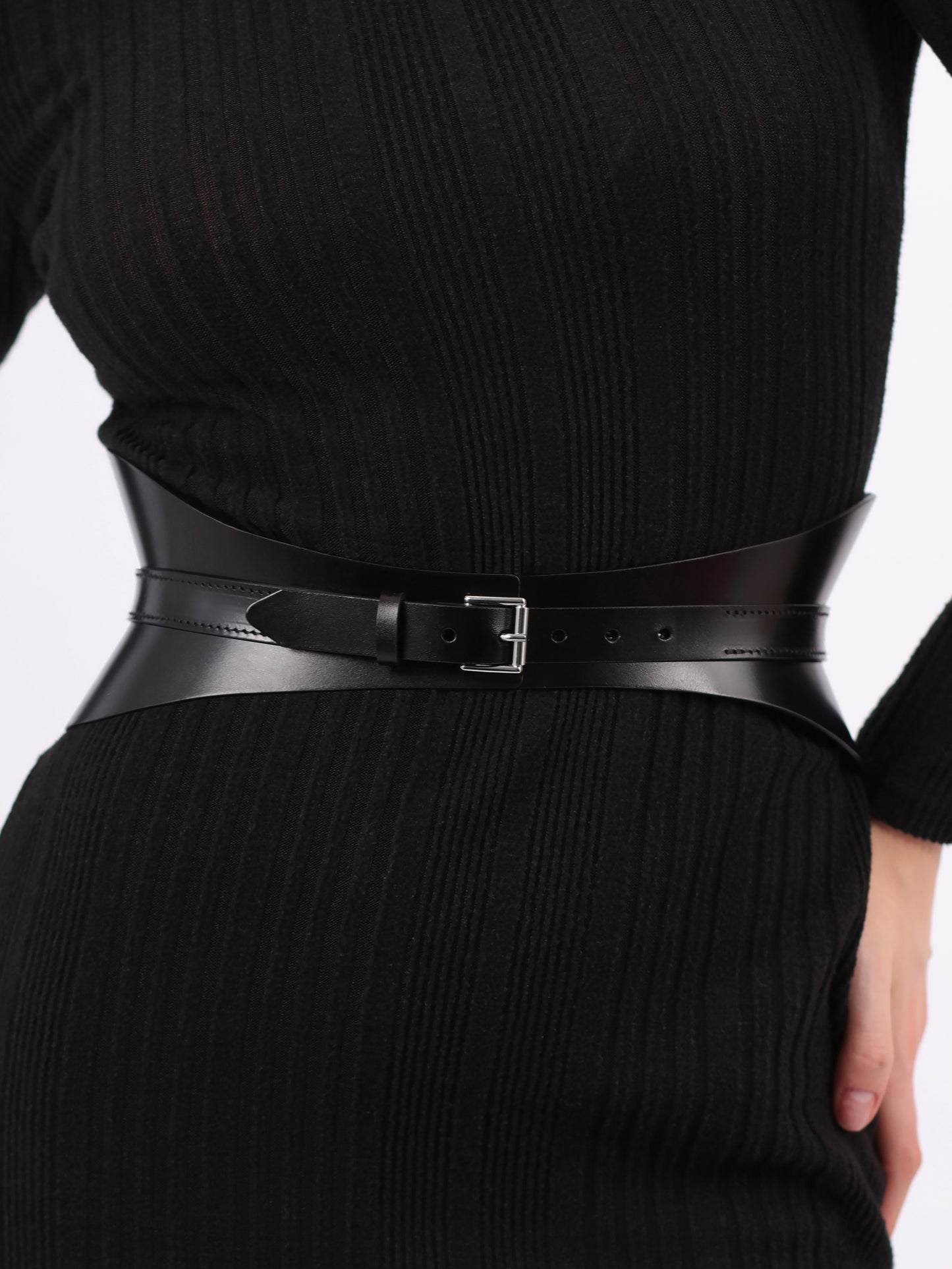 Detailed view of black corset belt.