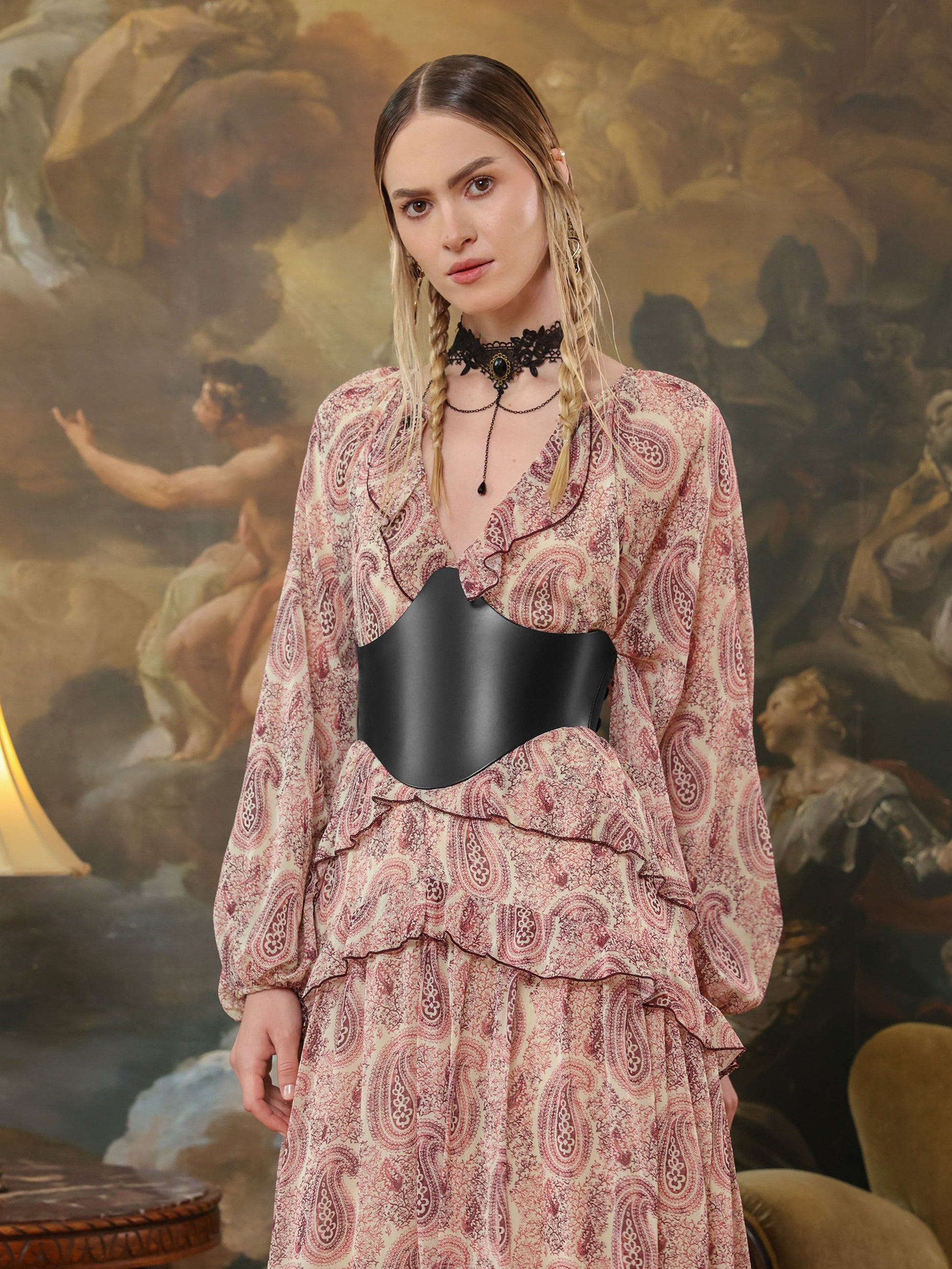 Fashion look combining a paisley dress with a bold black underbust belt for a cinched waist effect.