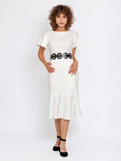Full outfit view of black leather high waist belt being worn over white dress.
