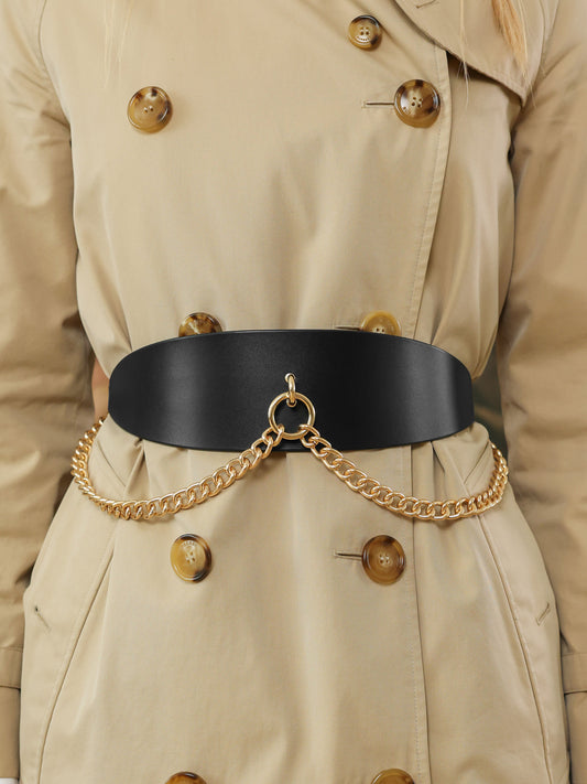 Close-up of a wide black leather belt with a polished gold chain accent against a beige trench coat.
