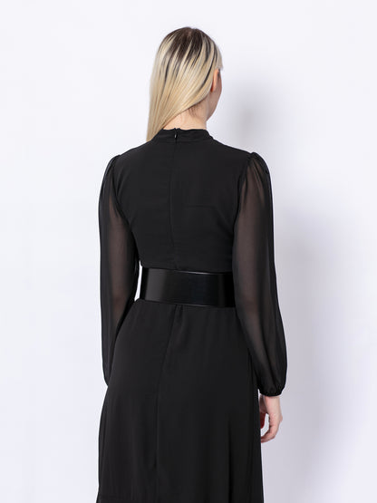Back view of wide corset belt worn by model over black dress.