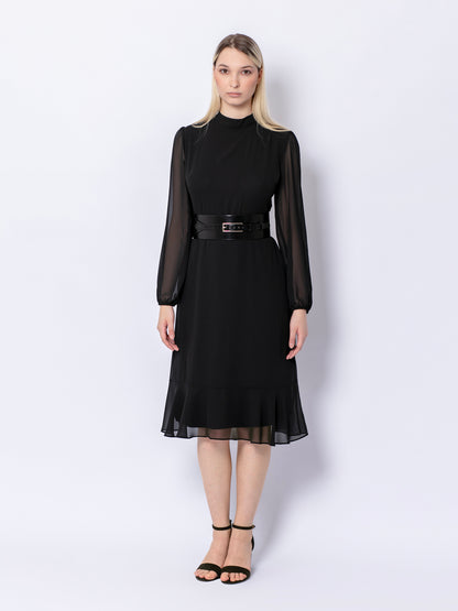 Full outfit view of wide corset belt worn by model over black dress.