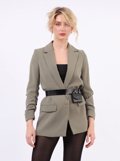 Micro Waist Belt Bag fitted on woman wearing green blazer.