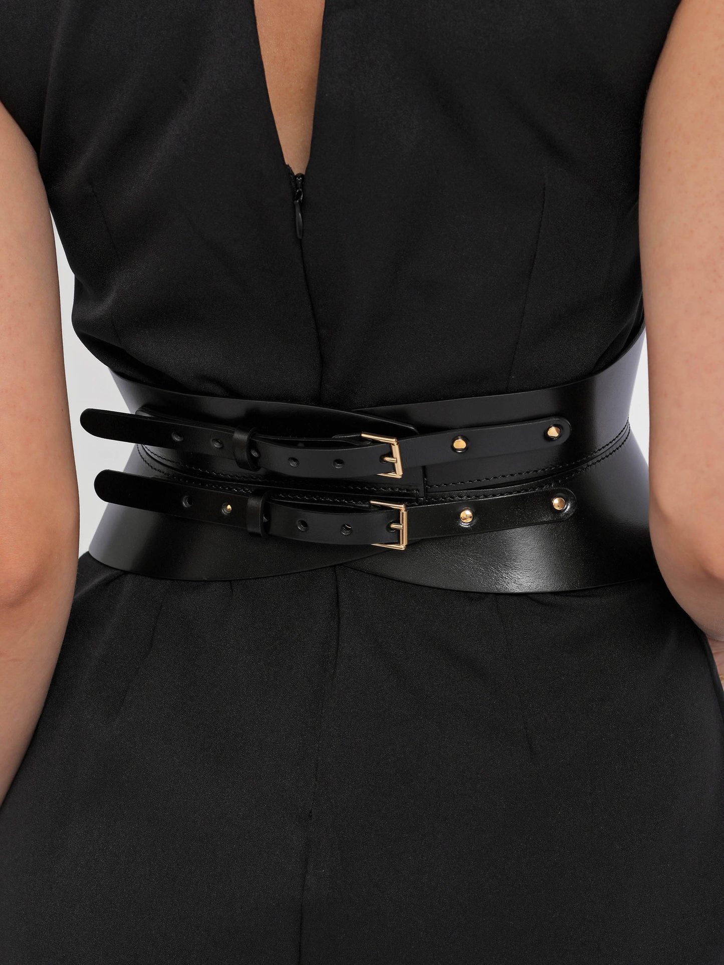 Back view of black leather corset belt.