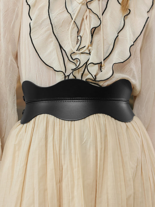 Black belt on a beige dress.
