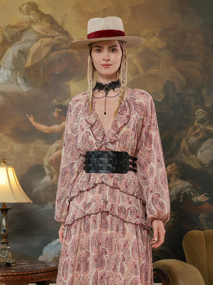 Corset-inspired black waist belt with modern cutout pattern, styled for a high-fashion look.