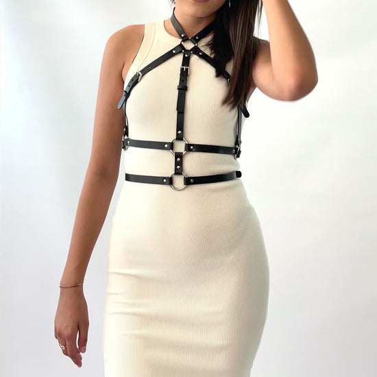 The double belt leather harness worn with a white dress.