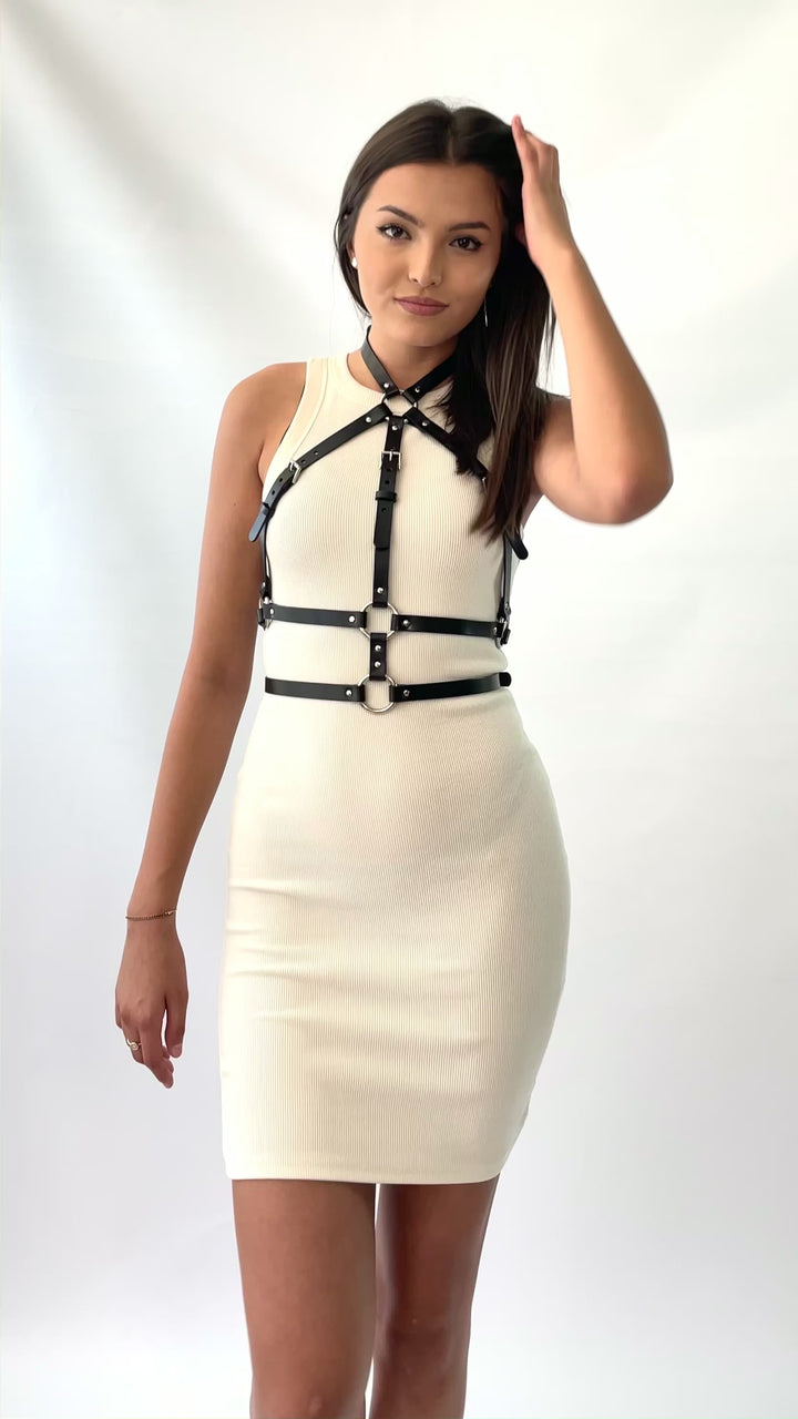 The double belt leather harness worn with a white dress.