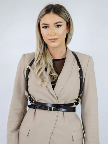 Black leather body harness.