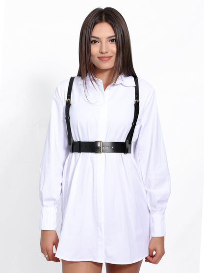 Black leather harness worn with white shirt.
