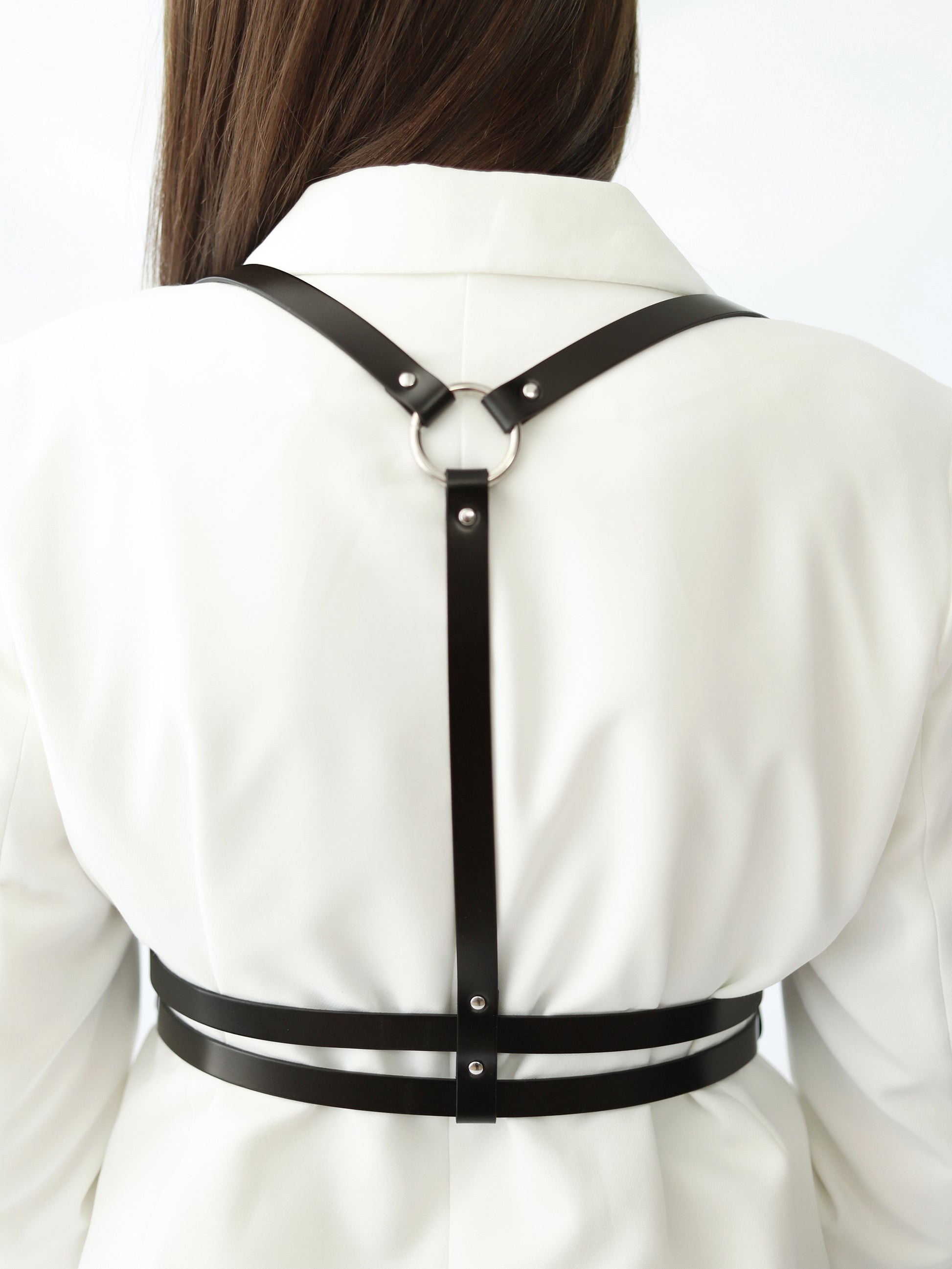 Back view of double belt leather harness.