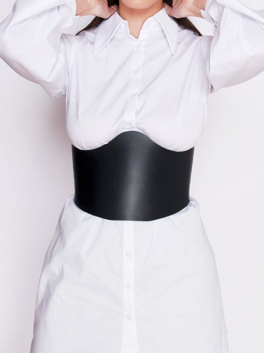 Front view of Black Underbust Corset Top worn by woman over white shirt.