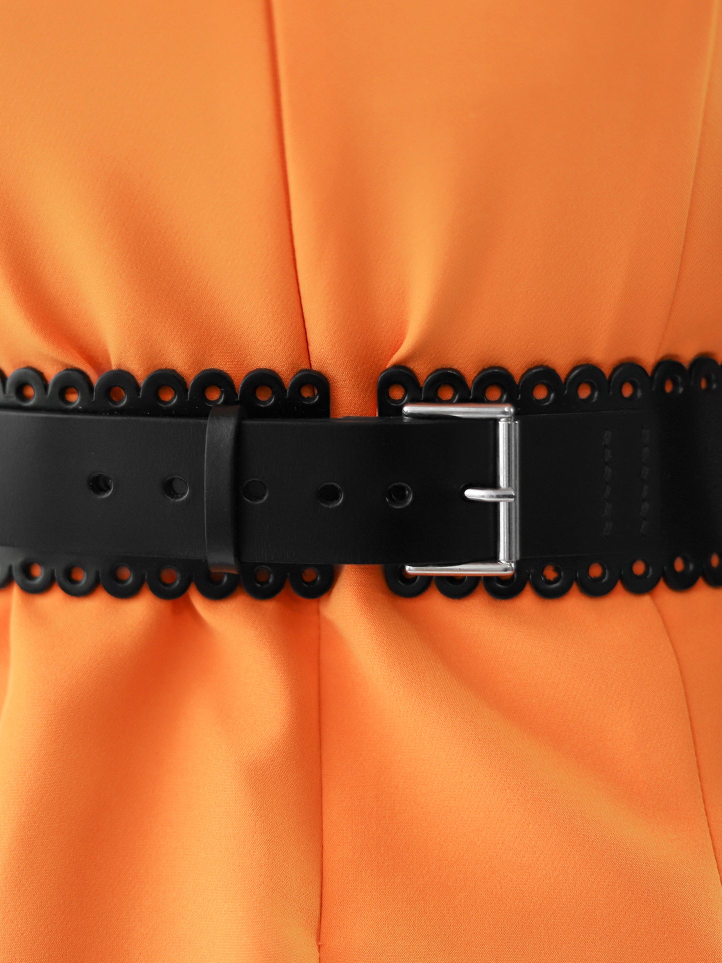 Close back view of scalloped leather belt.