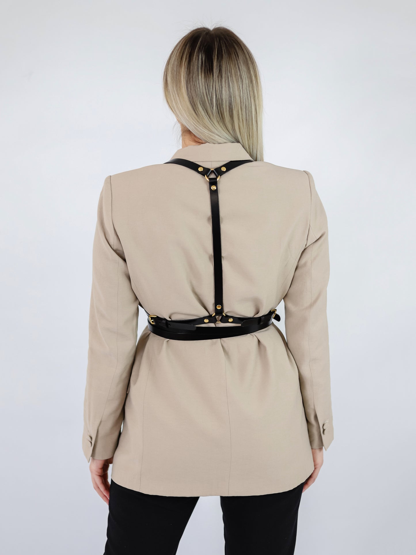 Back view of black leather harness.