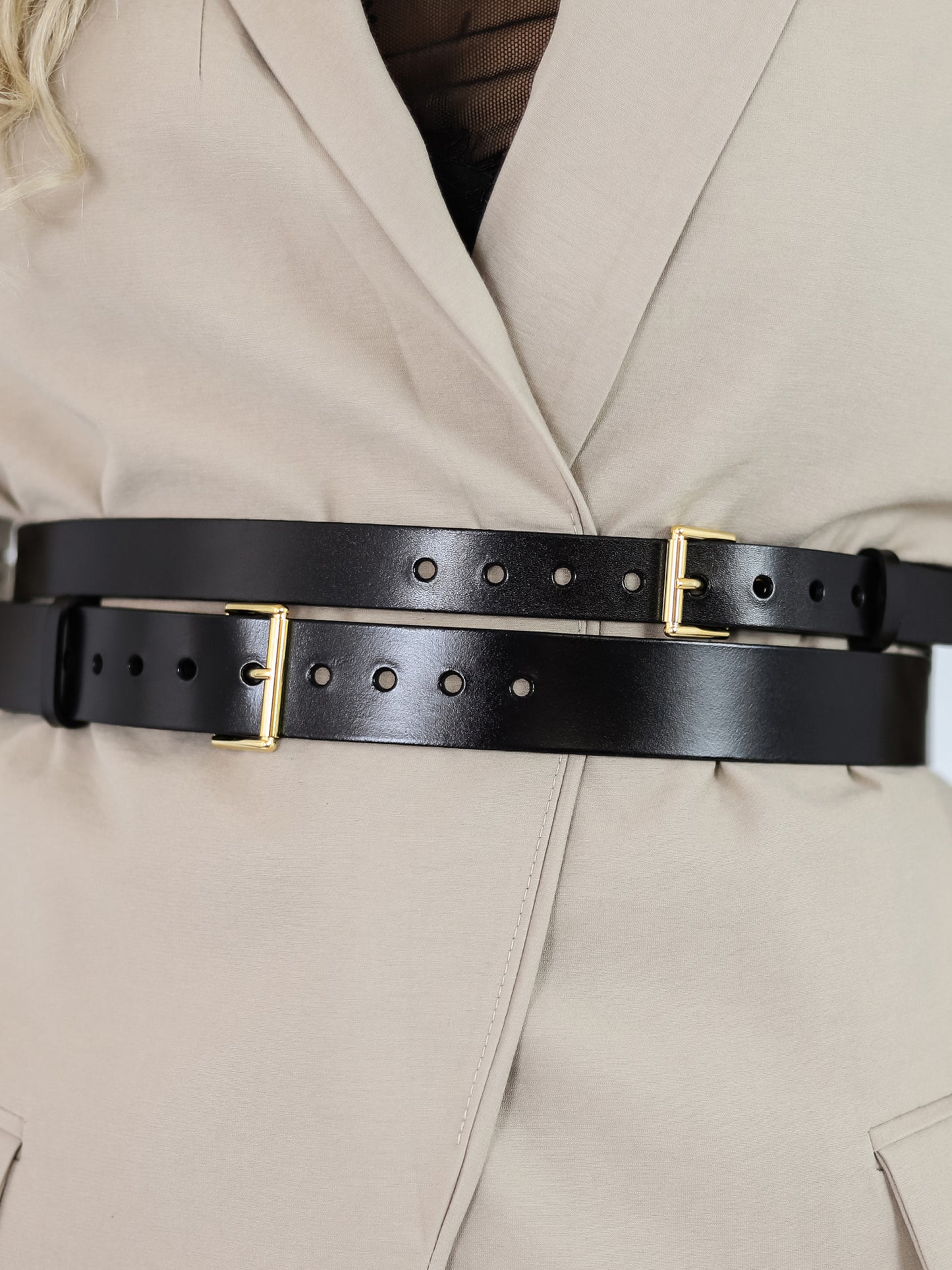 Black leather belt with double buckles.