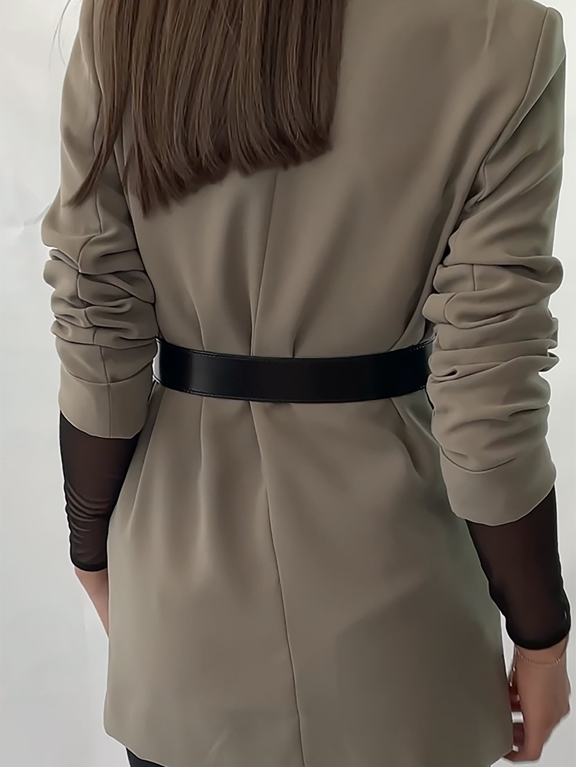 Back view of black women belt.
