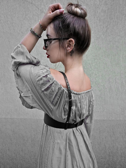 Side view of black leather underbust harness.